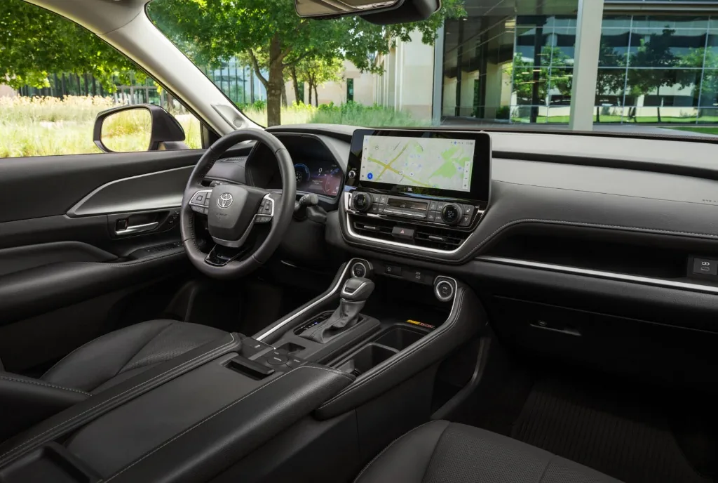 Toyota Grand Highlander interior dashboard featuring 12.3-inch multimedia touchscreen and leather upholstery
