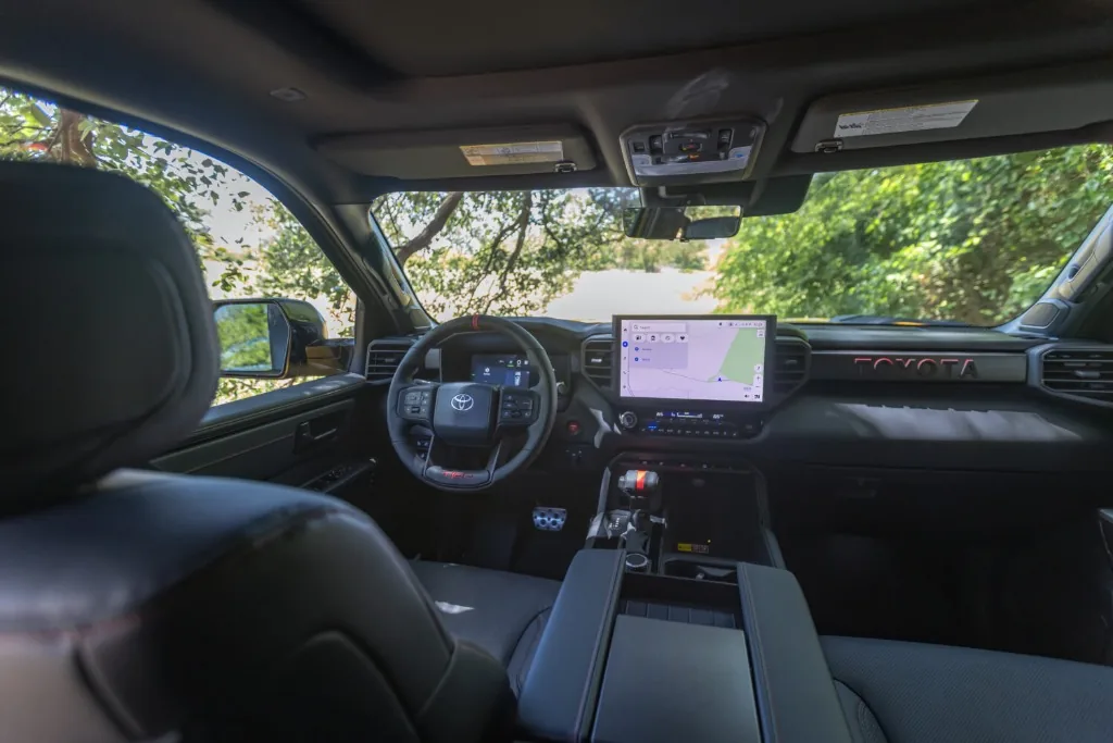 Toyota Tundra interior cockpit showcasing massive 14-inch Toyota Audio Multimedia display and TRD steering wheel